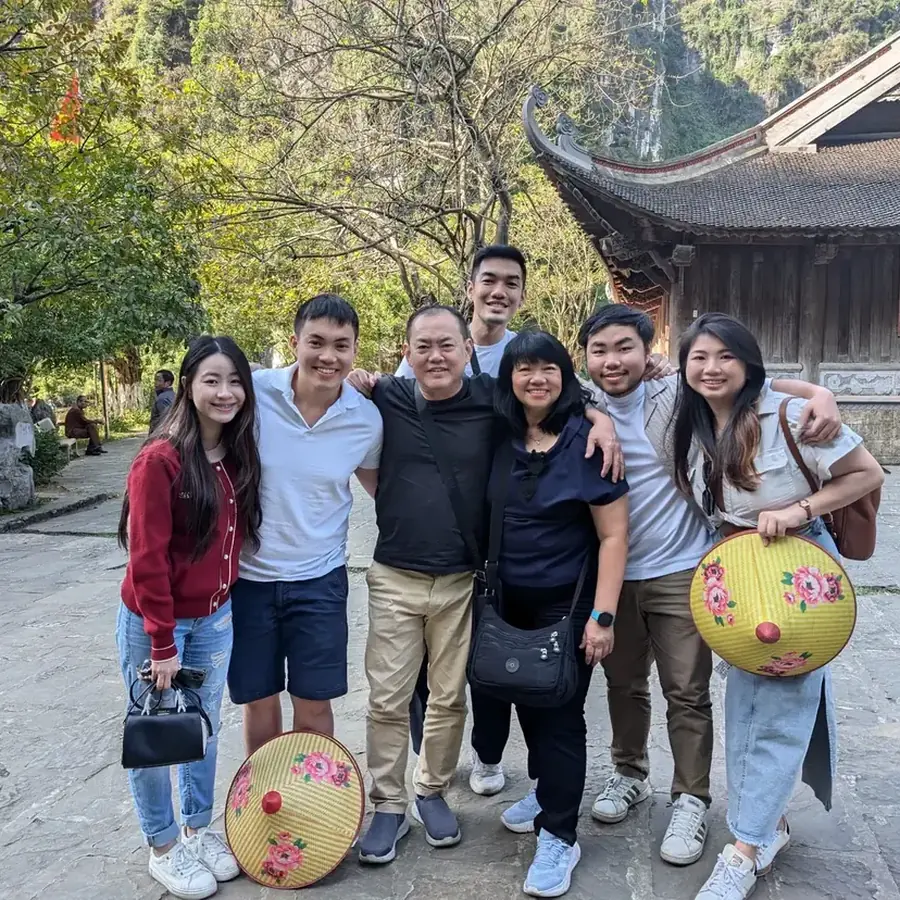 Family tour group at an ancient temple in Ninh Binh